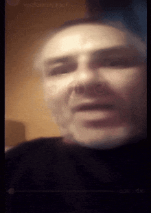 a blurry picture of a man 's face with the words verifiierter kauf on the bottom left
