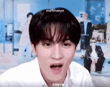 a close up of a person 's face with the name markhaeyo on the top