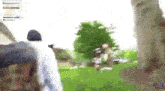 a blurry picture of a person walking in a park .