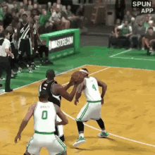 a basketball game is being played in front of a nbastore.com banner