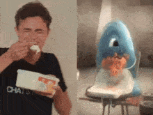 a man is eating a container of ice cream next to a picture of a shark .