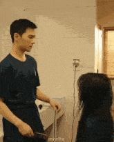 a man and a woman are standing in a bathroom with the words myntha on the bottom right