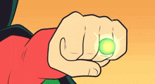 a cartoon drawing of a person 's fist holding a green ring