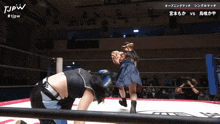 two women wrestling in a ring with tjpw written on the bottom of the screen