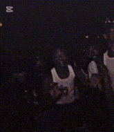 a group of people are posing for a picture and one of them is wearing a shirt that says ' dirty ' on it