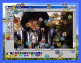 a computer screen with smiley faces on it and a window that says paint