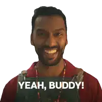 a man with a beard is smiling and says yeah buddy