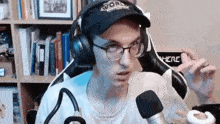 a man wearing headphones and a hat that says word