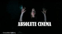 a poster for absolute cinema with a woman behind it
