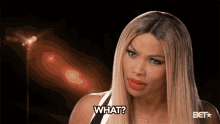 a woman with long blonde hair is asking what