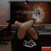 a person wearing a shirt that says twitch covering their eyes