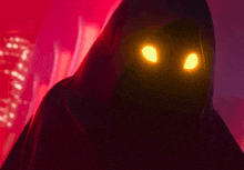a person in a hooded cape with bright yellow eyes