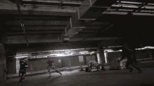 a person is standing in front of a purple and orange explosion