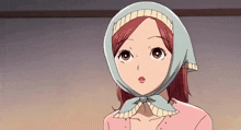 a girl wearing a scarf around her head looks surprised .