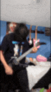 a man playing a guitar with the words that moment when just a burden by eyedin is playing