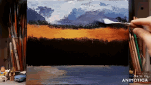 a painting is being painted on a canvas and the words made in animotica are visible