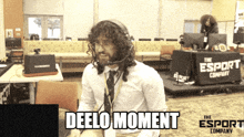 a man wearing a headset says deelo moment in front of the esport company