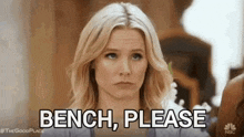 a woman is sitting on a bench and says " bench please "