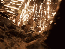 a group of people standing in front of a burning city