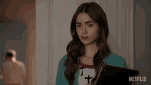 Shrug Lily Collins GIF - Shrug Lily Collins Emily Cooper GIFs