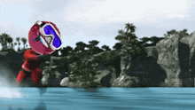 a pixelated image of a person in a red wet suit and goggles jumping into a body of water
