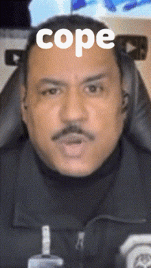 a man with a mustache and the word cope on his head