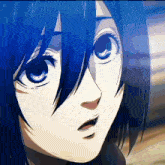 a close up of a girl 's face with a surprised look on her face