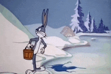 bugs bunny is holding a wooden bucket in the snow .
