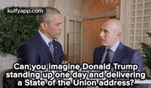 two men in suits and ties are standing next to each other and talking to each other .