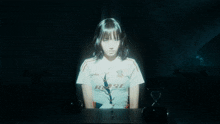 a girl wearing a white shirt that says raise on it
