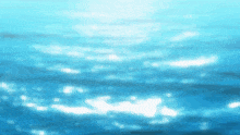 a blurred image of a body of water with the sun shining on it
