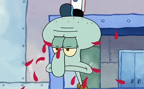 A GIF of Squidward frowning while SpongeBob 's hand throws flower petals at his face.