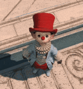 a child dressed as a clown wearing a top hat and red nose