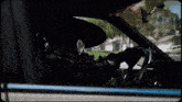 a person is sitting in a car with a hat on