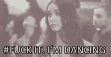 a black and white photo of a woman with the words " fuck it i 'm dancing " above her