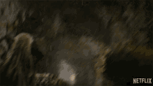 a netflix advertisement shows a person in a dark room