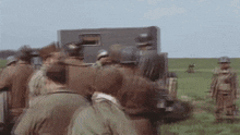 a group of soldiers standing in a field