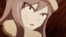 a close up of a girl 's face with a furry jacket on