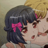 a close up of a girl with a pink bow on her hair