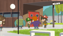 a group of cartoon characters standing in front of a building with the letters ok on it