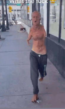 a man without a shirt is walking down a sidewalk with the words " what the fuck " written above him