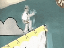 a man is standing on top of a yellow ruler .