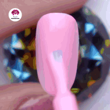 a close up of a pink nail with the words nails inspiration on the bottom right