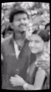 a black and white photo of a man and woman