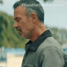 a man 's face is shown with the hashtag #iknowwhatyou didlastsummer visible