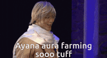 a man with a scarf around his neck and the words ayana aura farming sooo tuff written on the bottom