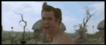Jim Carrey Tribal Man GIF - Jim Carrey Tribal Man Punch GIFs