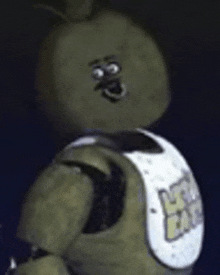 a cartoon character from five nights at freddy 's is standing in the dark wearing a vest .