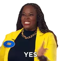 a woman in a yellow jacket with a name tag that says jodi on it