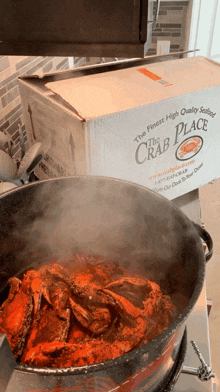 a box that says the finest high quality seafood the crab place
